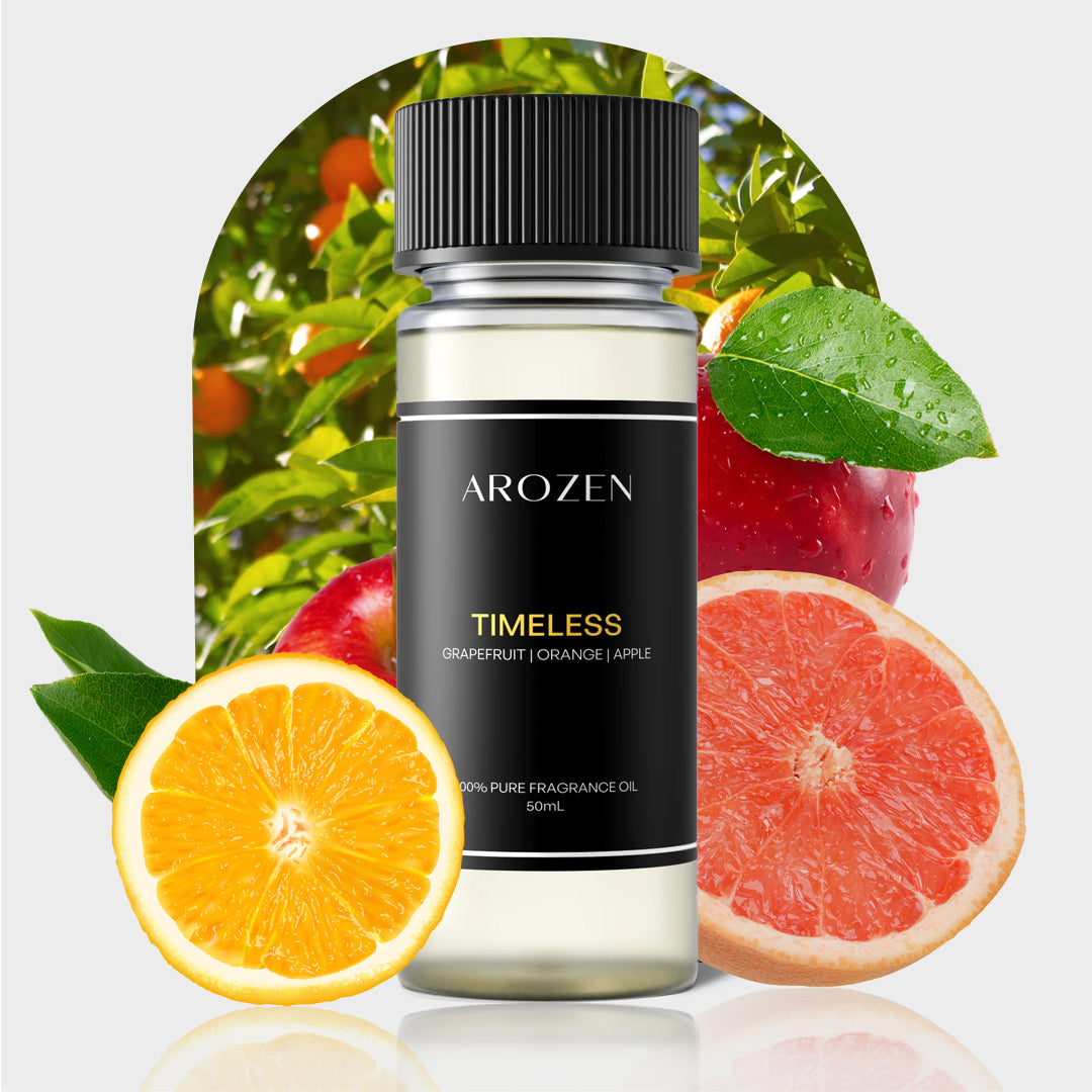 A bottle of TIMELESS fragrance oil with a black label is surrounded by grapefruit, orange, and apple slices, capturing a Marriott Hotels-inspired citrus aroma—ideal for your Electric Scent Diffuser.